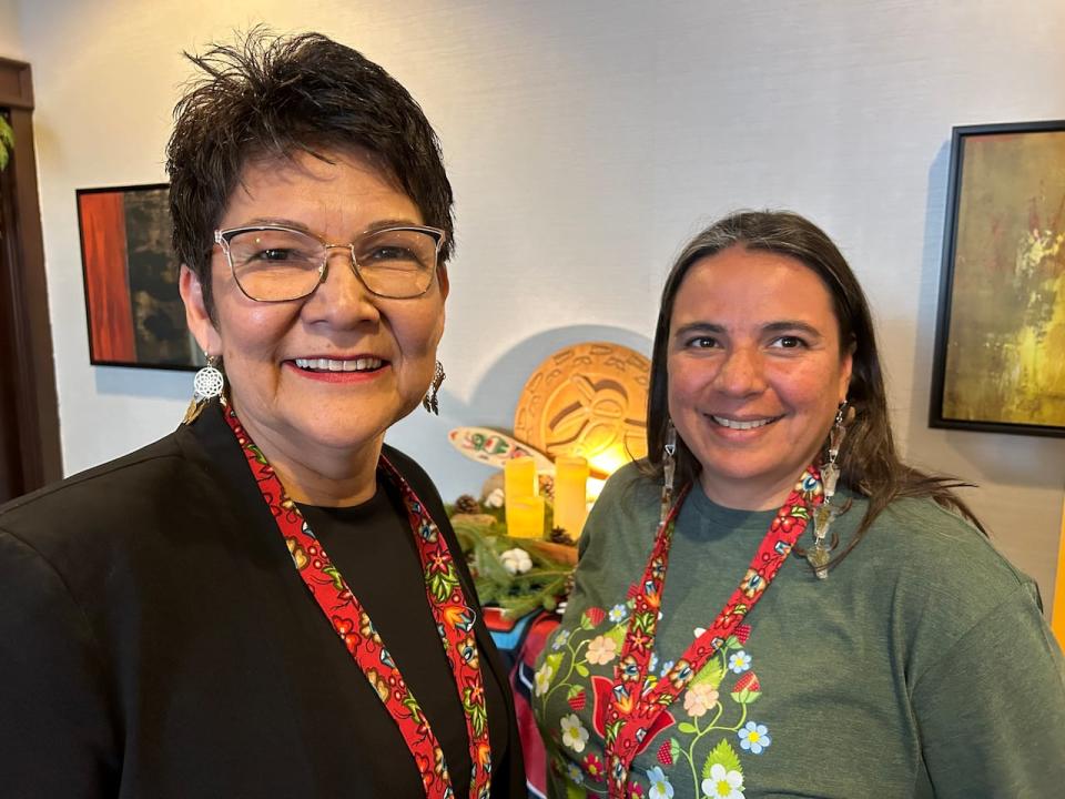 Eva Wilson Fontaine, left, the executive director of the Anish Corporation, and Angie Hutchinson, right, who's with the Southern Chiefs' Organization, were at the conference Sunday.