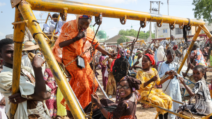 Children on swings at an amusement park in Kano, Nigeria - Monday 11 July 2022