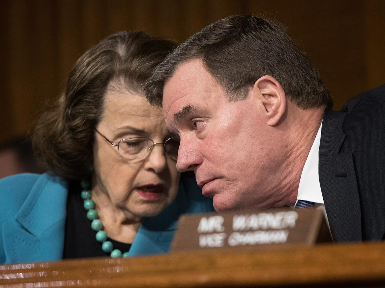 Sen. Dianne Feinstein, D-Calif., confers with Sen. Mark Warner, D-Va., during a Senate Intelligence Committee hearing in March 30. (Photo: Win McNamee/Getty Images)