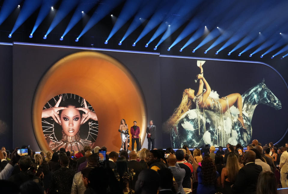 Beyonce accepts the award for best dance/electronic music album for "Renaissance" at the 65th annual Grammy Awards on Sunday, Feb. 5, 2023, in Los Angeles. James Corden watches on from right. (AP Photo/Chris Pizzello)