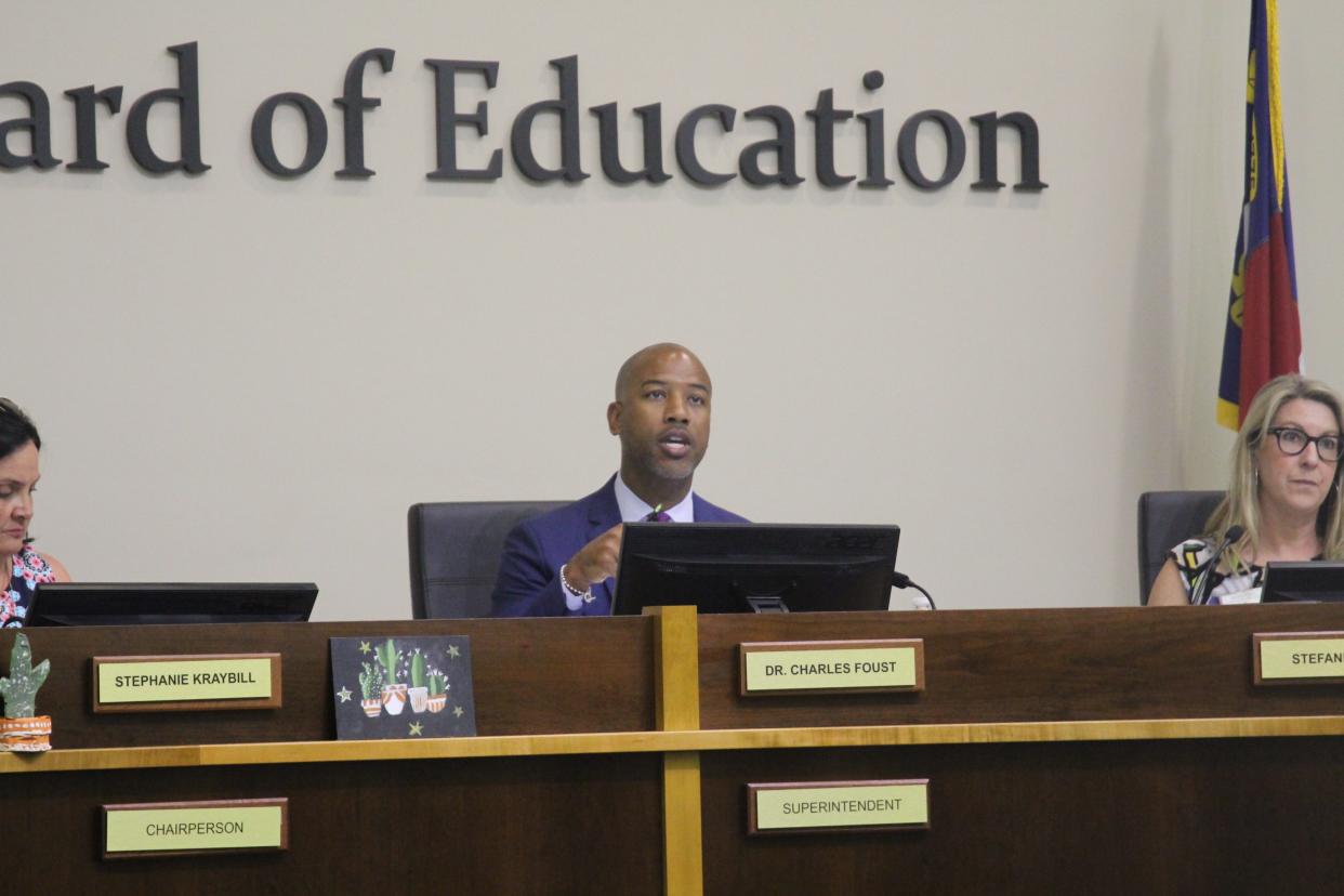 Superintendent Charles Foust presents information on funding at each New Hanover County school to the Board of Education during a meeting May 3, 2022.