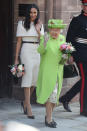 The Duchess of Sussex wore a sleek white dress for her first official appearance alongside Queen Elizabeth just one month after the royal wedding. It was made by her wedding dress designer, Clare Waight Keller. (Photo: Getty Images)