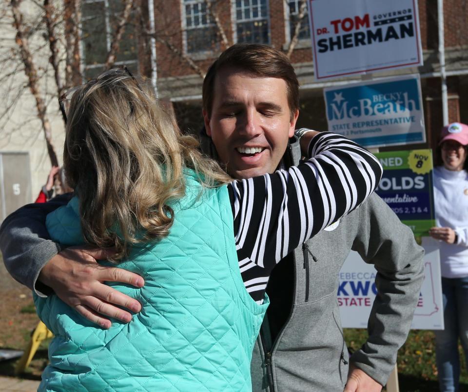 Congressman Chris Pappas gets a hug from a supporter outside a Portsmouth polling station Nov. 8, 2022.