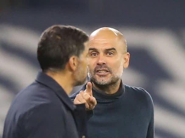 Pep Guardiola gestures as he exchanges words with Sergio Conceicao (POOL/AFP)