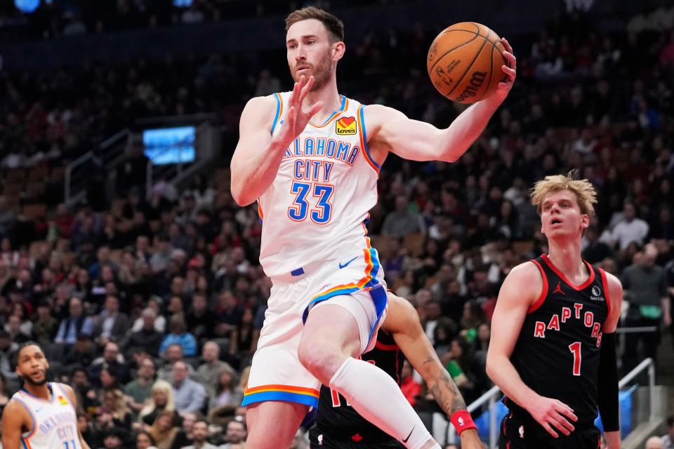 Thunder forward Gordon Hayward (33) goes to pass the ball as Raptors guard Gradey Dick (1) looks on during the first half at Scotiabank Arena on Friday night.