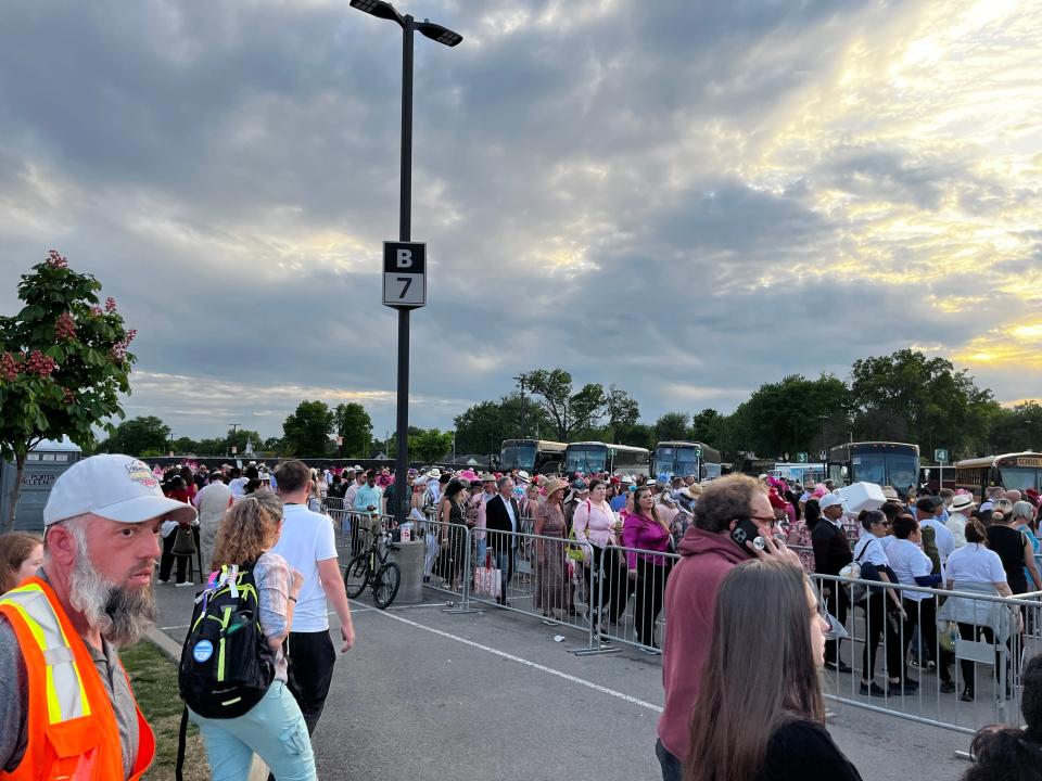 Huge lines of people await their shuttle back to the Expo Center after the Kentucky Oaks at Churchill Downs on Friday, May 5, 2023.