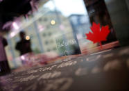 A man is reflected on an window of a refrigerator for the pork meat at HyLife Pork Table, a pork dish restaurant operated by Canadian pig farmer and pork processor HyLife, at Daikanyama district in Tokyo, Japan October 31, 2016. REUTERS/Issei Kato