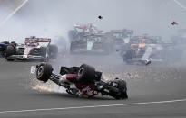 Alfa Romeo driver Guanyu Zhou of China crashes at the start of the British Formula One Grand Prix at the Silverstone circuit, in Silverstone, England, Sunday, July 3, 2022. (AP Photo/Frank Augstein)