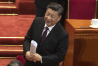 Chinese President Xi Jinping leaves after the opening session of the Chinese People's Political Consultative Conference in Beijing's Great Hall of the People, Sunday, March 3, 2019. (AP Photo/Ng Han Guan)