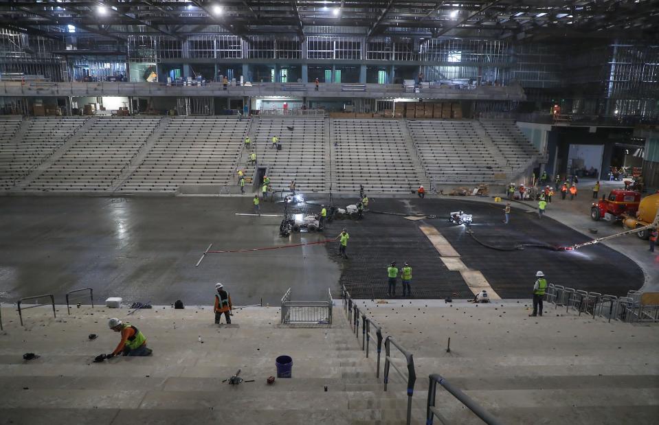Construction workers pour concrete for the hockey rink and build out the seating areas at the Acrisure Arena in Thousand Palms in August 2022. The arena is now home of the Coachella Valley Firebirds and regularly hosts concerts.