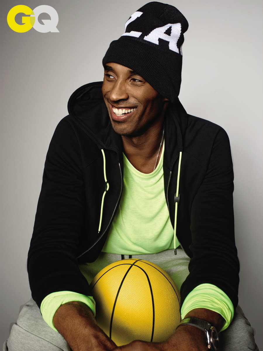 The baller redeemed himself by posing for GQ wearing a neon athleisure ensemble, in designer sweats. (Photo: GQ)