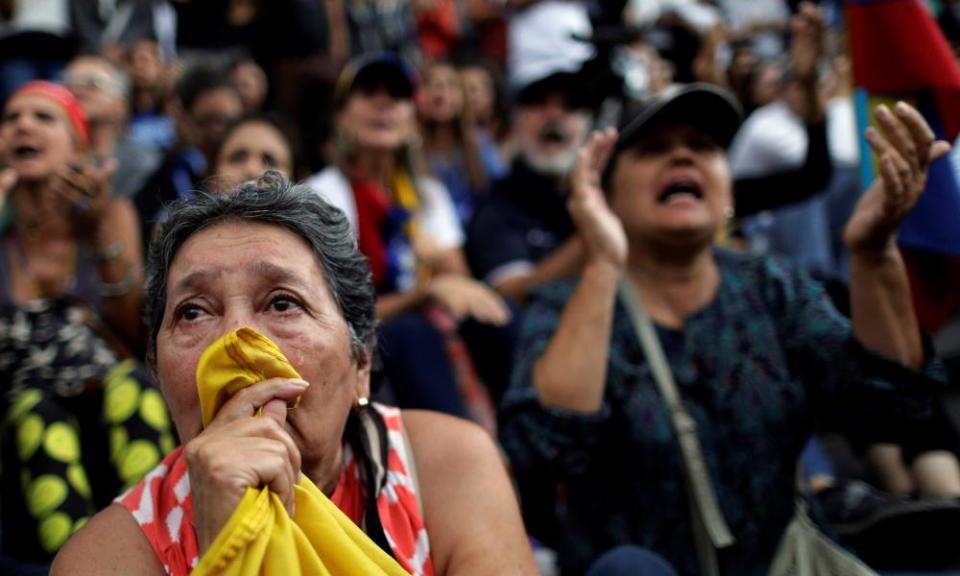 A woman cries during a rally in Caracas, where opposition supporters pay tribute to victims of violence in protests against Maduro’s government. 