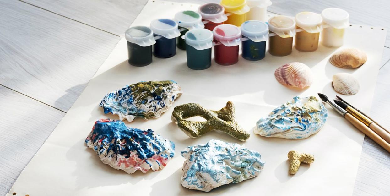 craft station with shells and coloured paints