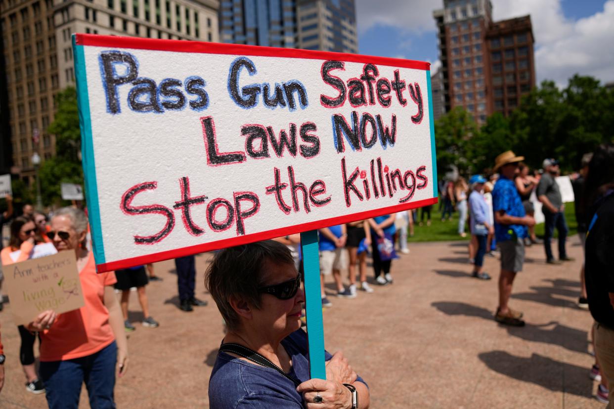 Niki Hird, of Clintonville, holds a sign encouraging gun safety laws during the March For Our Lives rally against gun violence June 11, 2022 at the Ohio Statehouse in Columbus. Hundreds gathered outside the Statehouse to protest recent mass shootings and encourage lawmakers to pass gun control legislation.