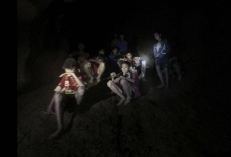 The group of Thai youth soccer players and their coach huddled inside the flooded cave in Chiang Rai province, northern Thailand. Source: AP