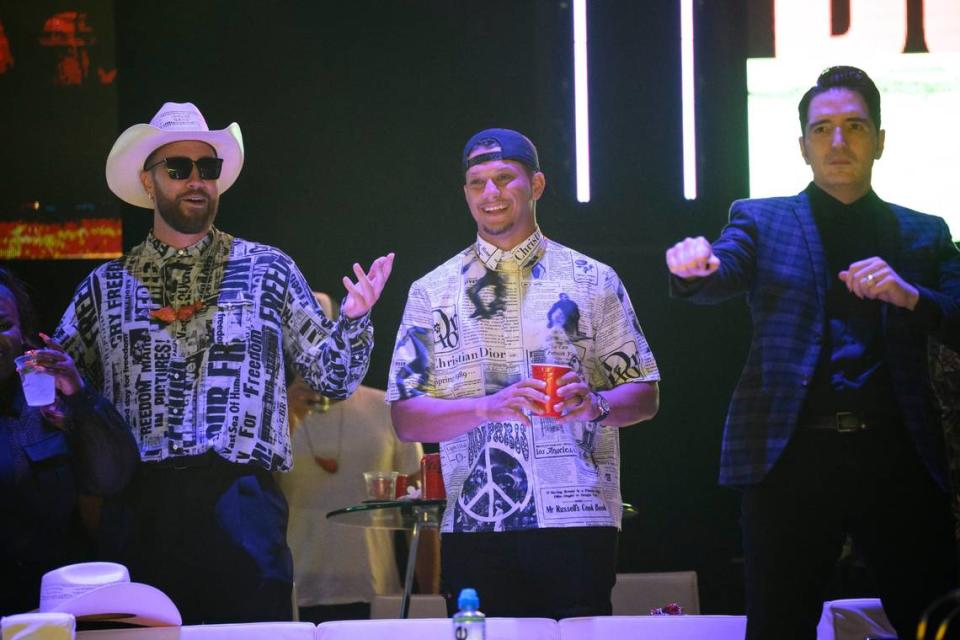 Kansas City Chiefs stars Travis Kelce, from left, and Patrick Mahomes, along with homegrown movie star David Dastmalchian watched the auction bidding at the Big Slick party and show at the T-Mobile Center in June.
