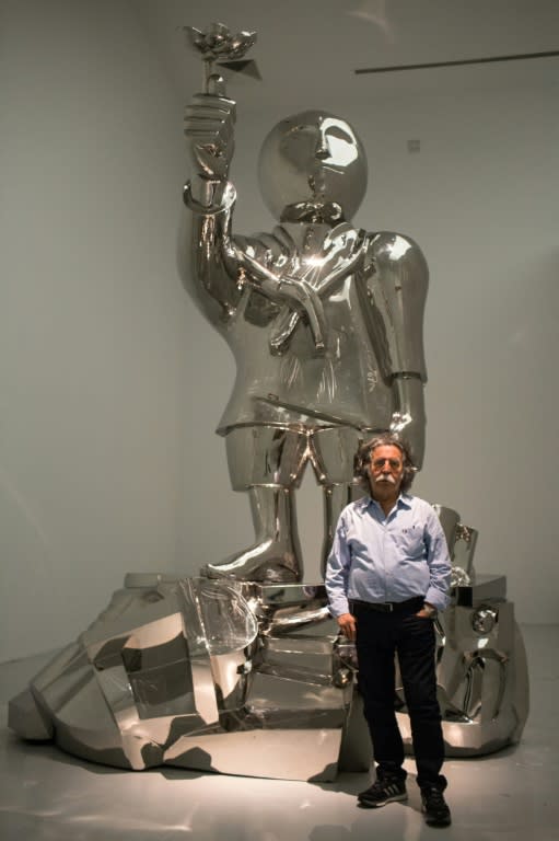 Iraqi artist Dia Al-Azzawi, pictured with his work titled "Handala, Good Morning Beirut," has not been back to Iraq since 1980 and says he refuses to visit