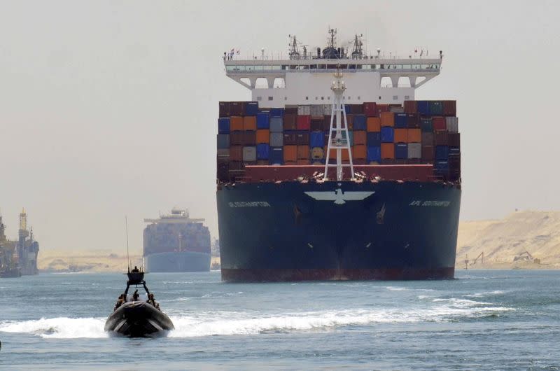 FILE PHOTO: A cargo ship is seen crossing through the New Suez Canal