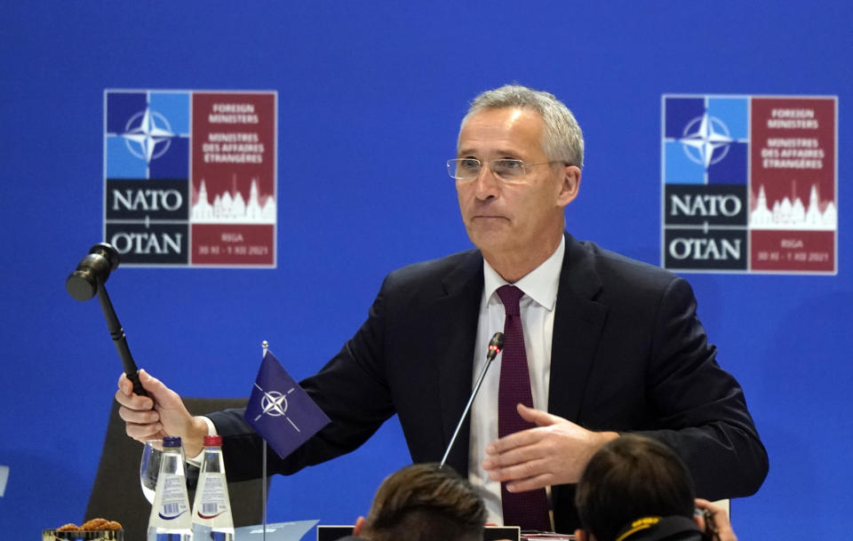 NATO Secretary General Jens Stoltenberg gestures as he opens the NATO Foreign Ministers meeting in Riga, Latvia, Wednesday, Dec. 1, 2021. (AP Photo/Roman Koksarov)