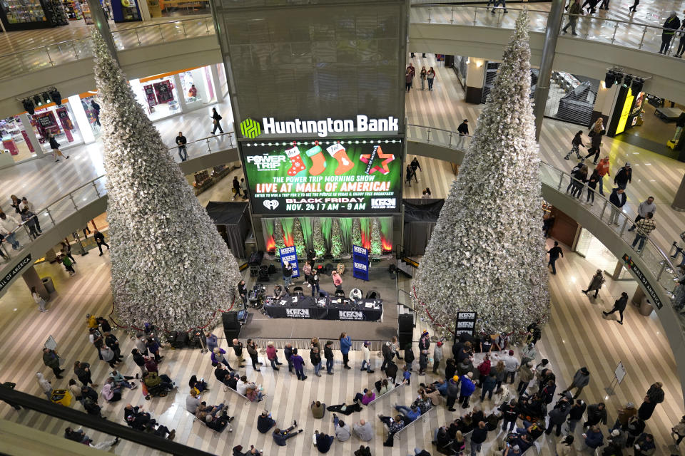 FILE - People shop at Mall of America, Friday, Nov. 24, 2023, in Bloomington, Minn. Billboard has posted a list of top seasonal hits since 2010, and Mariah Carey's “All I Want for Christmas is You” has been No. 1 for 57 of the 62 weeks it has run, says the chart director. The song is so omnipresent that the Wall Street Journal wrote last year about retail workers driven batty by how many times it comes on in their stores, including one who retreats to the stockroom every time he hears the distinctive opening bells. (AP Photo/Abbie Parr, File)