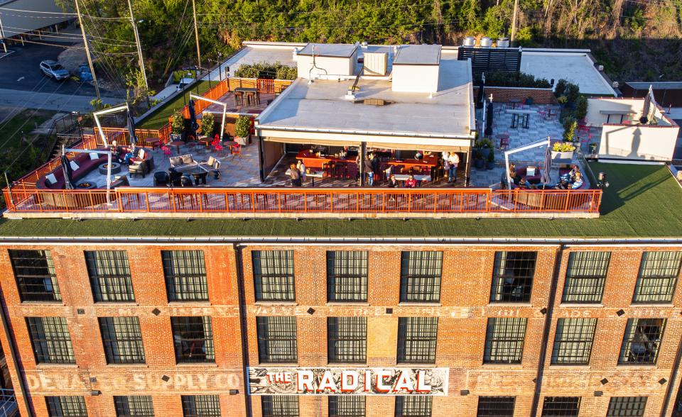 The Radical offers a rooftop bar with views looking over the River Arts District.