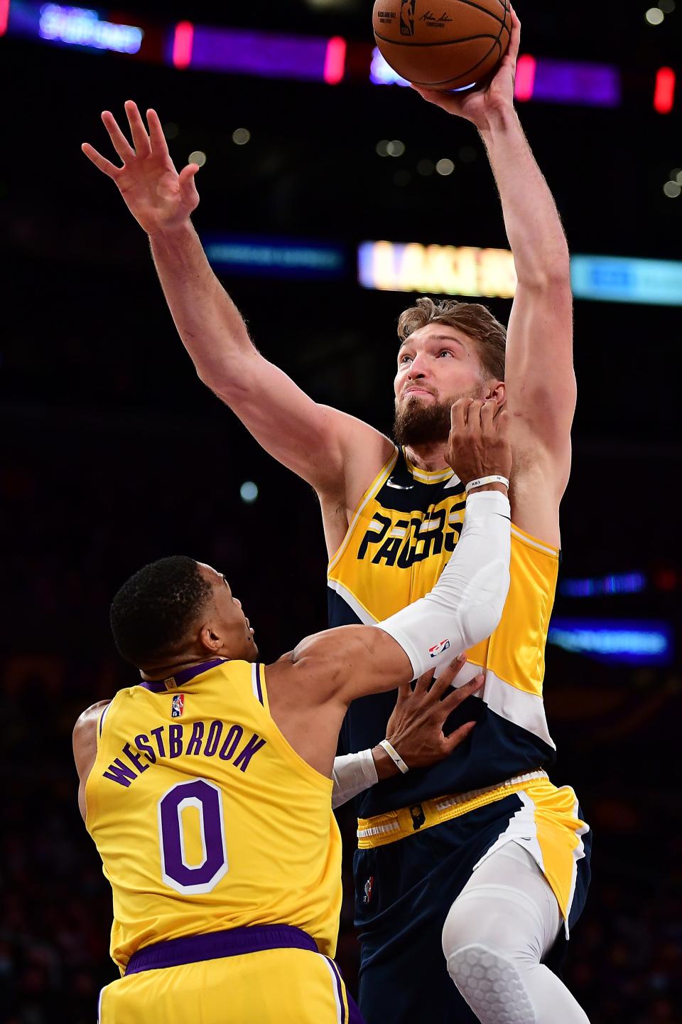 Jan 19, 2022; Los Angeles, California, USA; Indiana Pacers forward Domantas Sabonis (11) moves to the basket against Los Angeles Lakers guard Russell Westbrook (0) during the first half at Crypto.com Arena. Mandatory Credit: Gary A. Vasquez-USA TODAY Sports