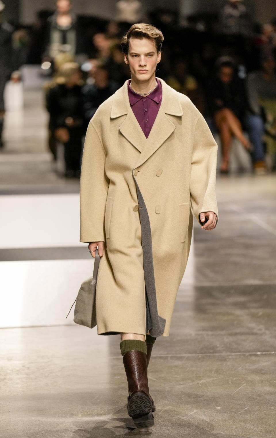 A model wears a creation as part of the men's Fendi Fall-Winter 2024-2025 collection, that was presented in Milan, Italy, Saturday, Jan. 13, 2024. (AP Photo/Antonio Calanni).