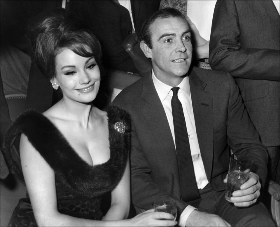 French actress Claudine Auger and Scottish actor Sean Connery answer journalists' questions at a hotel in Paris on Feb. 19, 1965.