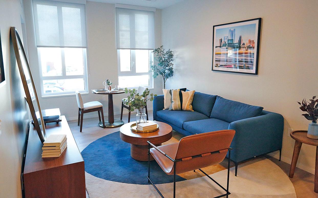 The living room of a studio apartment at the new Stone apartment building, part of the Center and Stone development on Hancock Street in Quincy.