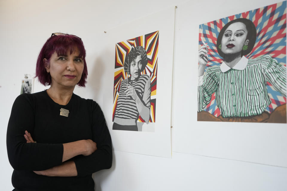 Artist Soheila Sokhanvari in her studio with pieces of her artwork at Wysing Arts Centre near Cambridge, England, Wednesday, Aug. 30, 2023. Soheila Sokhanvari is an Iranian-born artist whose latest work paid homage to the pre-1979 revolutionary feminists in Iran. Since the death of Mahsa Amini in September 2022, Iranians worldwide have taken to the street as an act of resistance against the Islamic Republic. Marking the one year anniversary of Amini's death, which has been a potent symbol of resistance, three prominent Iranian women in the U.K. speak to AP on their fight for the future of Iran. (AP Photo/Kirsty Wigglesworth)