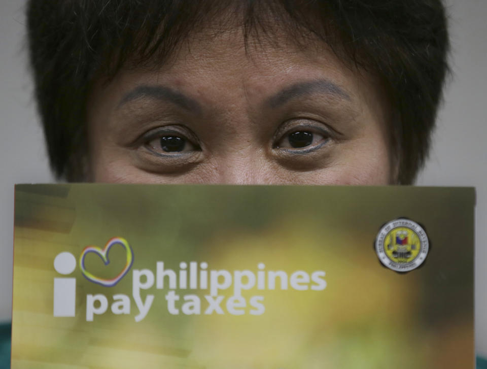 In this Feb. 4, 2014 photo, Bureau of Internal Revenue Commissioner Kim Henares speaks during an interview at her office at suburban Quezon city, northeast of Manila, Philippines. The petite sharp-shooting bureaucrat in charge of getting Filipinos to pay their fair share of taxes couldn’t have chosen a higher profile target: Manny Pacquiao, the world champion boxer and hero to millions. Henares has remained steadfast in her campaign against the boxer, who also was listed as the country’s wealthiest member of Congress last year. The Philippines posted 7.2 percent growth in gross domestic product last year, the second highest in Asia after China, but government revenue has fallen short of expectations in a country where decades of corrupt and inefficient government allowed a culture of tax evasion to flourish. (AP Photo/Bullit Marquez)