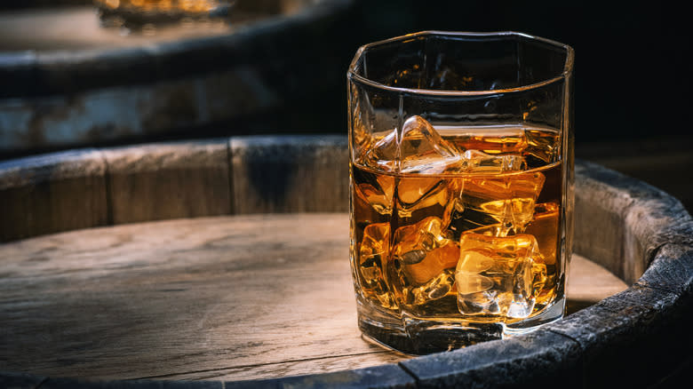 A glass of whiskey with ice