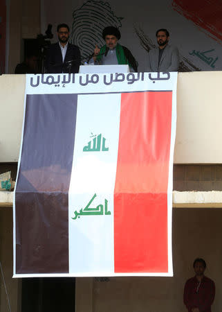 Iraqi Shi'ite cleric Moqtada al-Sadr speaks during a protest against corruption and informs his followers about his will at Tahrir Square in Baghdad, Iraq March 24, 2017. REUTERS/Alaa Al-Marjani