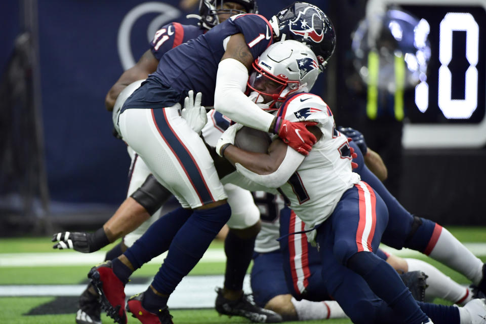 New England Patriots running back Damien Harris (37) rushes for a touchdown as Houston Texans' Lonnie Johnson Jr. defends during the first half of an NFL football game Sunday, Oct. 10, 2021, in Houston. (AP Photo/Justin Rex)