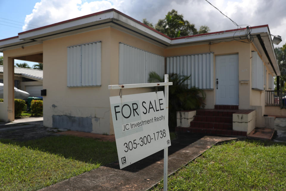 MIAMI, FLORIDA - SEPTEMBER 30: A for-sale sign is seen in front of a home on September 30, 2020 in Miami, Florida. A National Association of Realtors survey showed pending home sales rose 8.8% in August compared with July, reaching a record-high pace. Reports indicate that low mortgage rates have helped fuel the buying spree. (Photo by Joe Raedle/Getty Images)