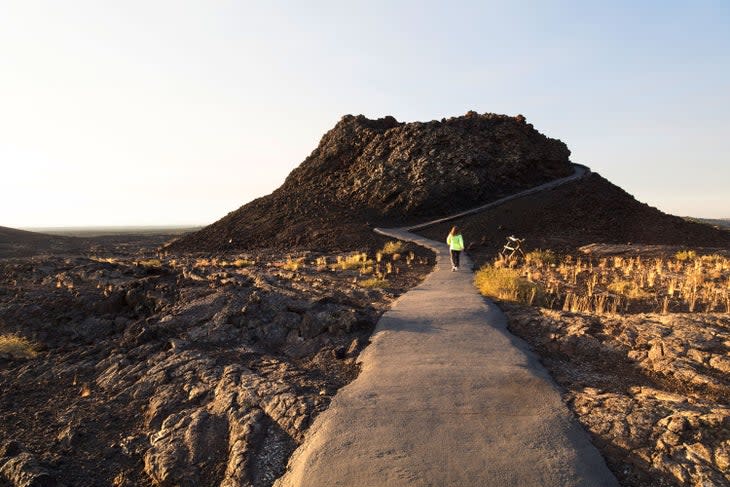 Hiker on the Spatter Cones Trail in Craters of the Moon National Monument