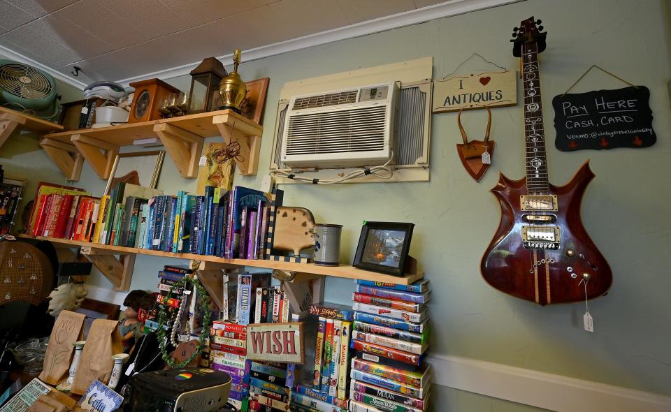A $1,200 guitar hangs on the wall at Vintage Rebel Curiosity Shop.