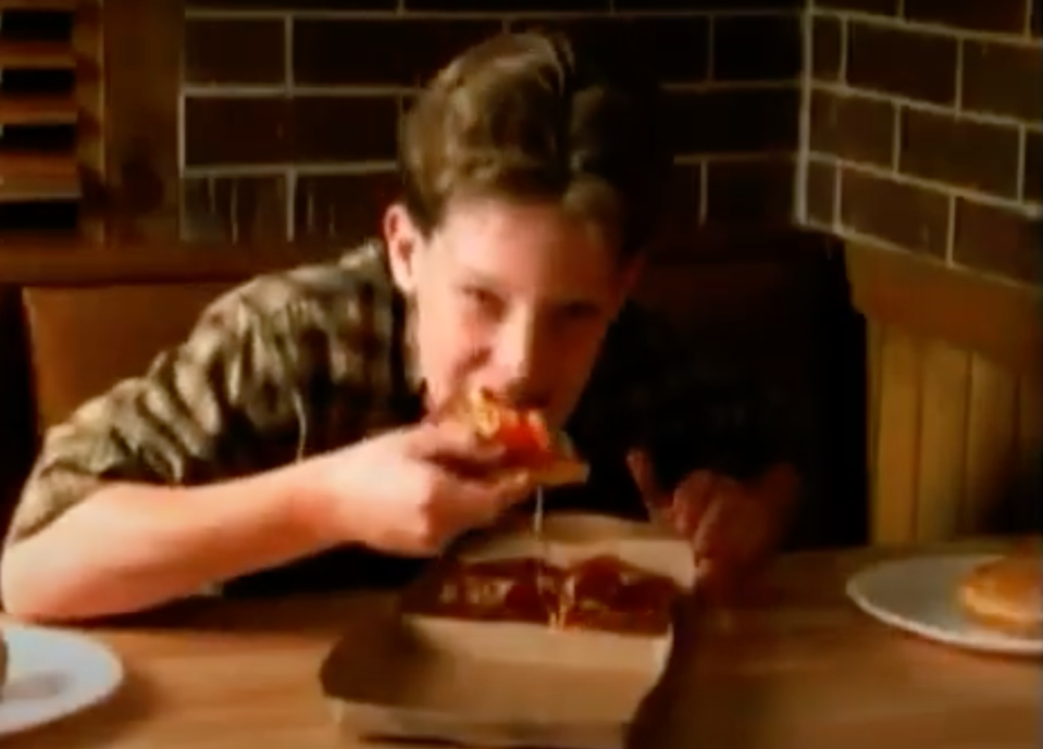 kid eating a personal pizza