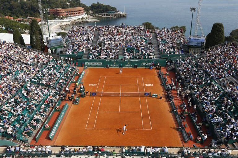 Serbia's Novak Djokovic hits a return to Russia's Mikhail Youzhny during a Monte-Carlo ATP Masters Series Tournament tennis match on April 17, 2013 in Monaco. Top three seeds Djokovic, Andy Murray and Rafael Nadal all made winning starts at the Monte Carlo Masters on Wednesday