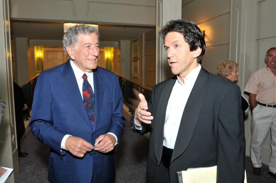 Tony Bennett and Mitch Albom speak during a benefit event for Albom's book "Have a Little Faith" in Philadelphia in 2009.