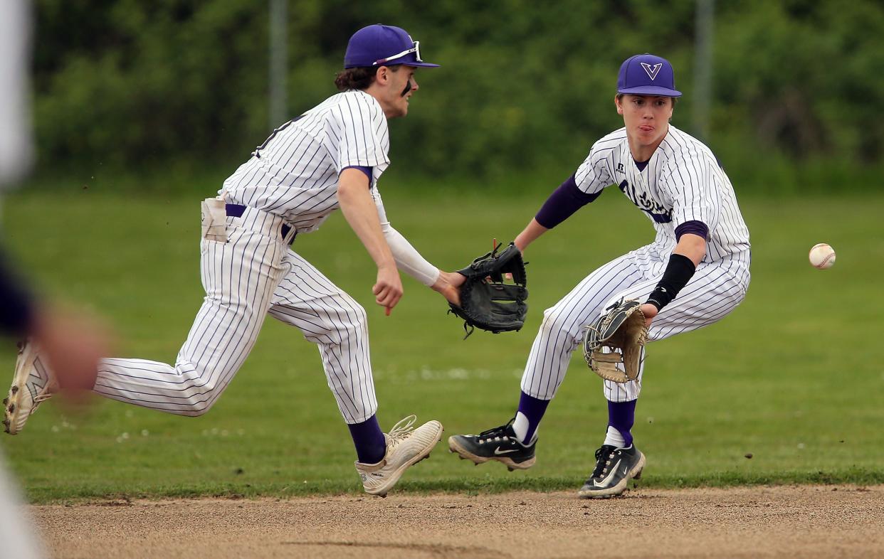 North Kitsap’s Alex Elton, left, and Chase McDaniel both go for a ground ball during their 2-1 win over Franklin Pierce on Tuesday, May 7, 2024. Elton snagged the ball and threw to first for an out.