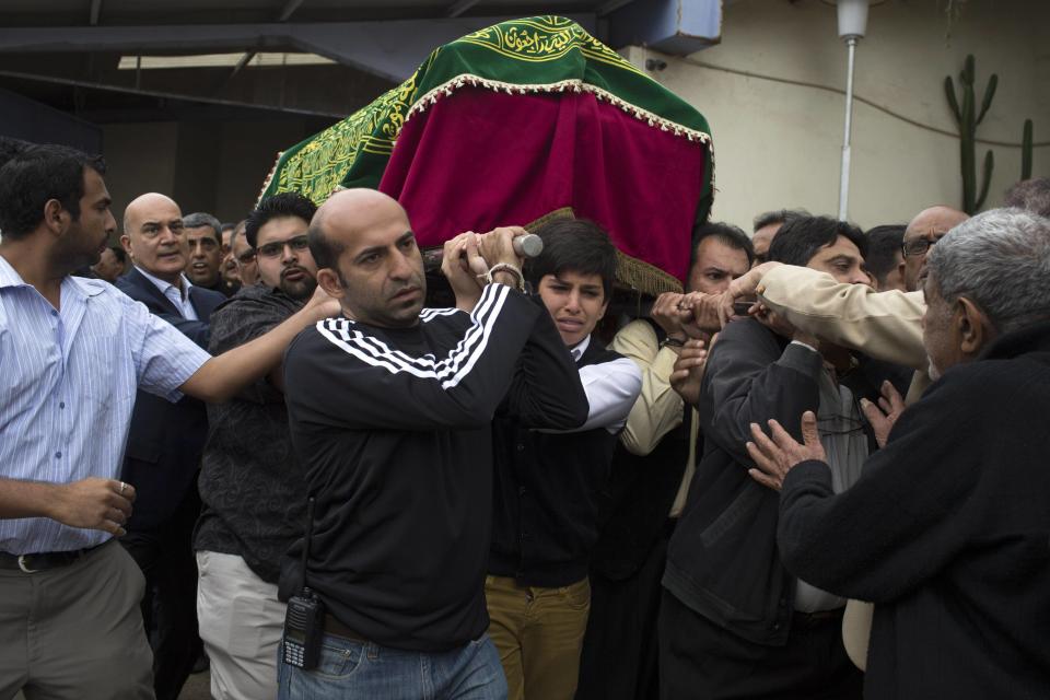 Relatives carry a coffin during the funeral procession for Selima Merali and her daughter Nuriana who were killed in the attack by gunmen at the Westgate Shopping Centre in Nairobi