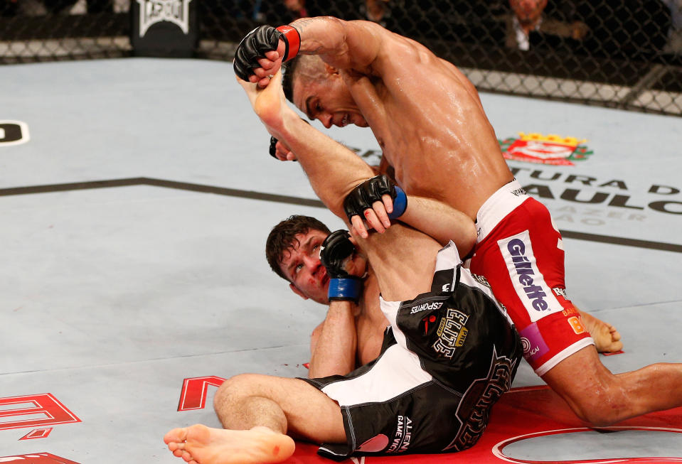 SAO PAULO, BRAZIL - JANUARY 19:  Vitor Belfort (top) punches down at Michael Bisping in their middleweight fight at the UFC on FX event on January 19, 2013 at Ibirapuera Gymnasium in Sao Paulo, Brazil. (Photo by Josh Hedges/Zuffa LLC/Zuffa LLC via Getty Images)