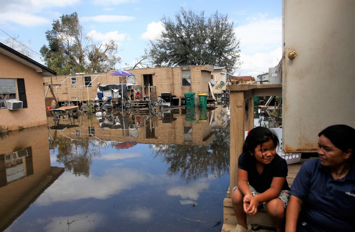 Flooding from hurricanes like Irma in Florida can overwhelm sewer systems and spread pathogens in other ways. <a href="https://www.gettyimages.com/detail/news-photo/with-their-homes-surrounded-by-water-that-they-fear-may-be-news-photo/846597496" rel="nofollow noopener" target="_blank" data-ylk="slk:Brian Blanco/Getty Images;elm:context_link;itc:0;sec:content-canvas" class="link ">Brian Blanco/Getty Images</a>