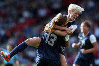Alex Morgan #13 of USA is congratulated by Megan Rapinoe after scoring during the Women's Football first round Group G Match of the London 2012 Olympic Games between United States and France, at Hampden Park on July 25, 2012 in Glasgow, Scotland. (Photo by Stanley Chou/Getty Images)
