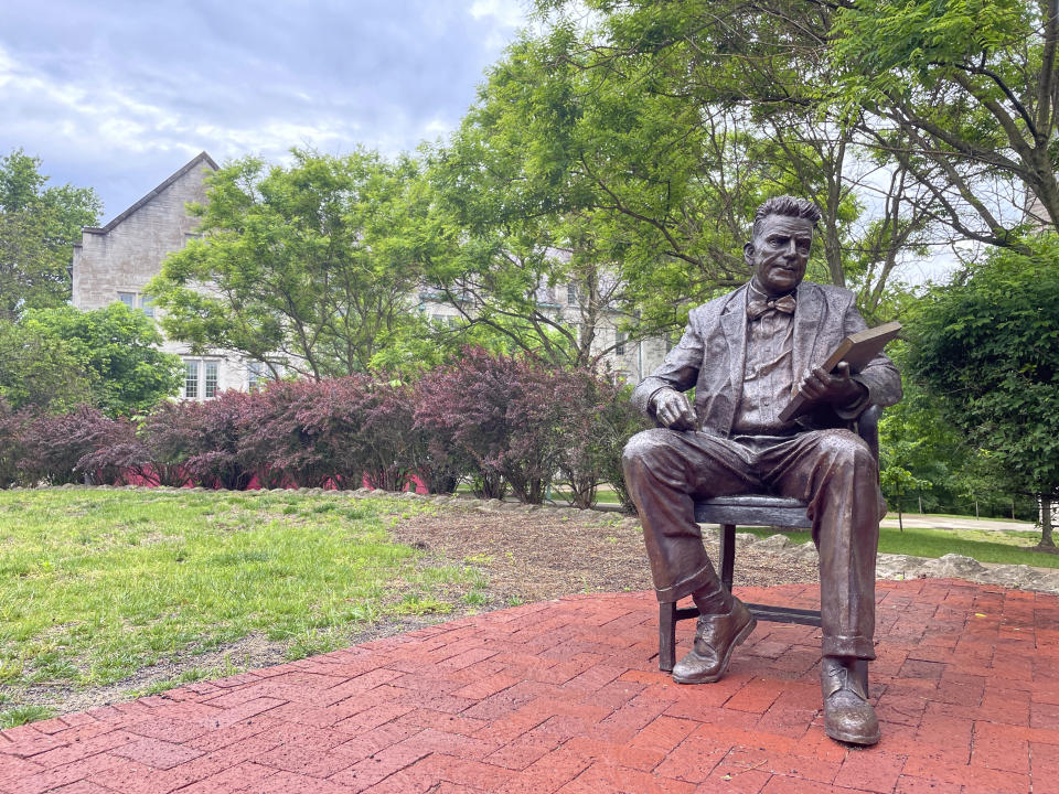 A bronze sculpture of Alfred Kinsey, a sex researcher who founded Indiana University's branch of sex research, the Kinsey Institute, sits outside the institute's research facility, Tuesday, May 16, 2023, in Bloomington, Ind. (AP Photo/Arleigh Rodgers)
