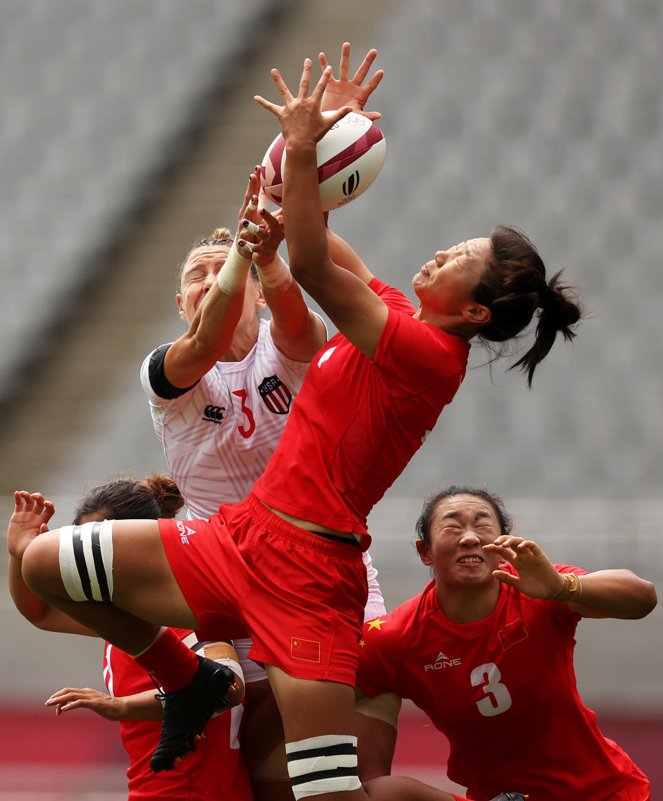 <p>Min Yang of Team China wins the ball over Abby Gustaitis of Team United States in the Women’s pool C match between Team United States and Team China during the Rugby Sevens on day six of the Tokyo 2020 Olympic Games at Tokyo Stadium on July 29, 2021 in Chofu, Tokyo, Japan. (Photo by Dan Mullan/Getty Images)</p> 
