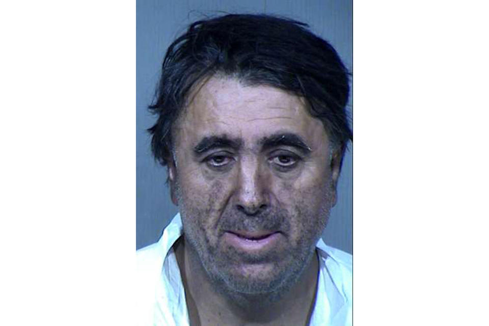 This undated booking photo provided by the Maricopa County Sheriff's Office shows 56-year-old Rafael Loera. Loera and his wife, 50-year-old Maribel Loera, are accused of intentionally setting their west Phoenix home ablaze after their children were taken by the state, leading firefighters to find unidentified skeletal remains. They have been booked on suspicion of arson, child abuse and concealment of a dead body. Authorities haven't determined whether the remains belong to a child or adult. (Maricopa County Sheriff's Office via AP)