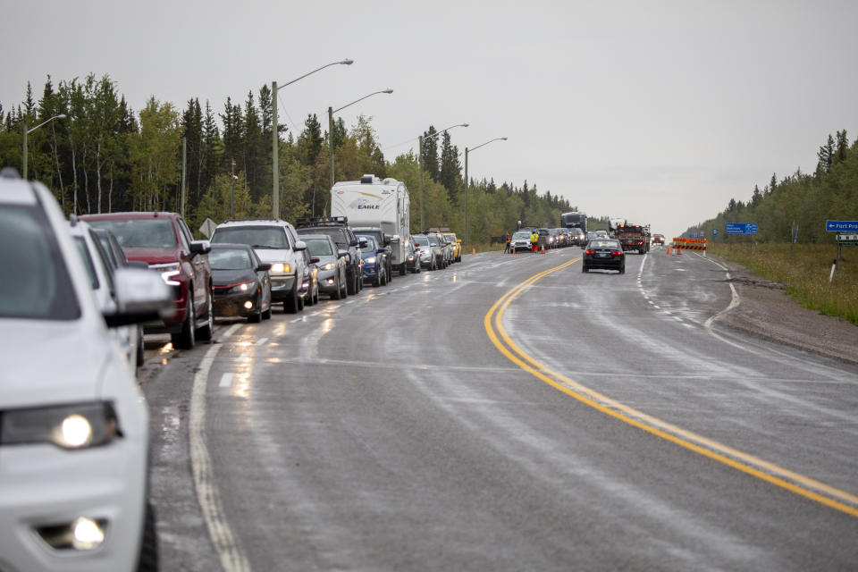Evacuees from Yellowknife, territorial capital of the Northwest Territories, queue up to get gas at Big River Service in Ft. Providence, N.W.T., Thursday, Aug. 17, 2023. (Bill Braden /The Canadian Press via AP)