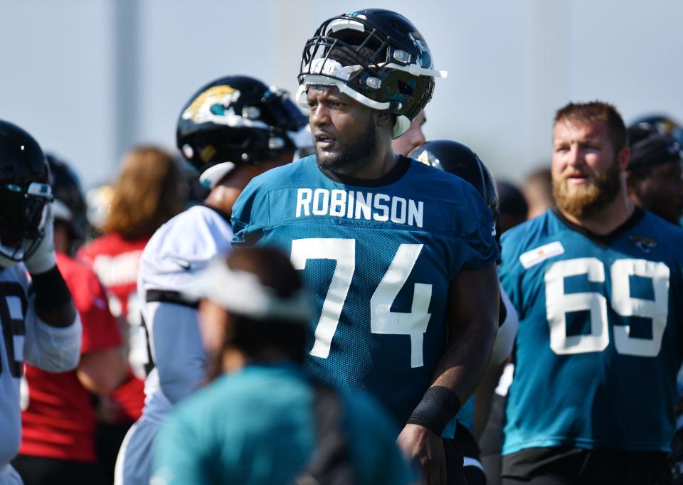 Jaguars OL (74) Cam Robinson wears his jersey backwards during Wednesday's training camp session. The Jacksonville Jaguars training camp session, Wednesday, July 28, 2021, at the team's practice fields outside TIAA Bank Field.